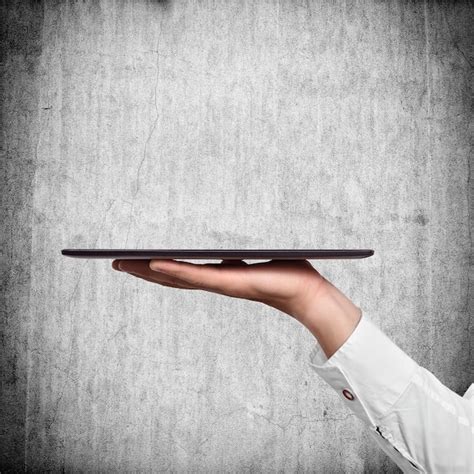 premium photo hand holding tablet