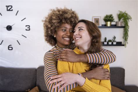 Beautiful And Cheerful Multiracial Lesbian Couple Hugging And Looking Each Other Smiling Lovely