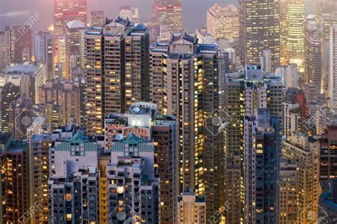 Telephoto Of Hong Kong High Rise Apartment Buildings At Night Stock