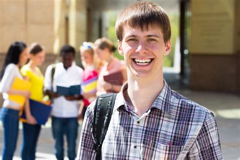 College Boy Holding Books Blurred Students Park Stock Photos Free