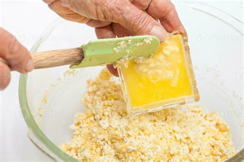 Traditional Colombian Arepa De Choclo Preparation Adding Melted Butter