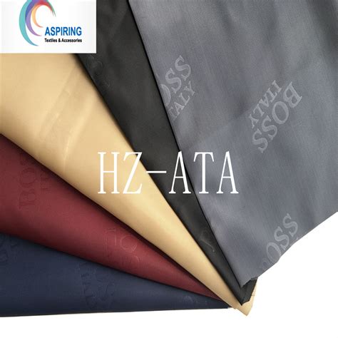 190t 210t Embossed Polyester Taffeta Lining Fabric 53gsm Dobby Design For Garment China