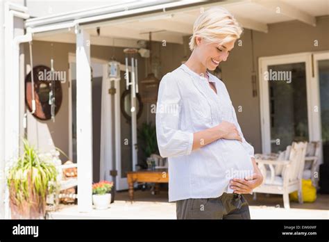 Smiling Blonde Pregnant Hand On His Belly Stock Photo Alamy