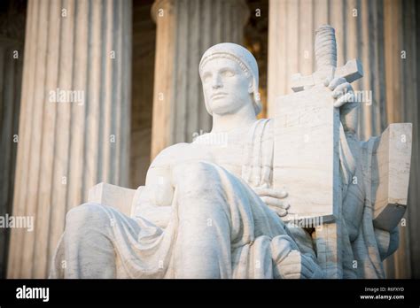 Authority Of Law Statue At The Neoclassical Columned Entrance To The Us