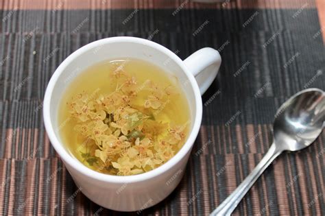 Premium Photo | In a white cup flower tea made from medicinal plants ...