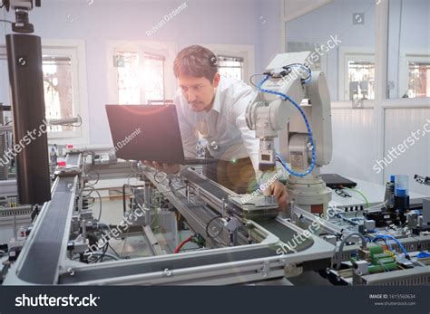 Closeup Engineer Holding Product Teach Robot Stock Photo Edit Now