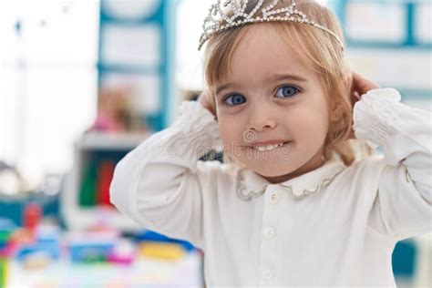 Adorable Blonde Girl Smiling Confident Wearing Princess Crown At