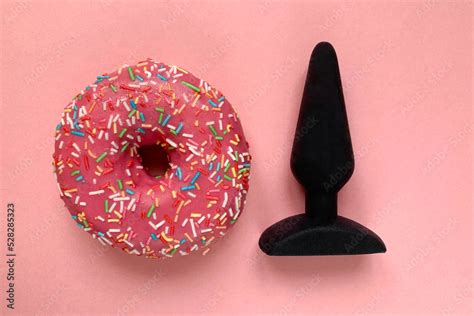 Sex Toy And Donut Black Butt Plug On Pink Background Stock Photo Adobe Stock