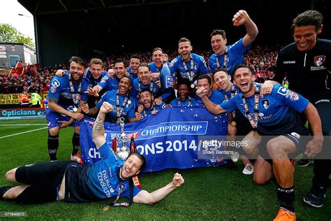 Bournemouth Players Celebrate With The Trophy After Winning The