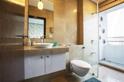 Bathroom Design With Brown Tiles Livspace