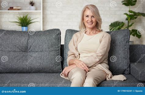 Mature Caucasian Blonde Woman Mother Or Wife Is Smiling Stock Image