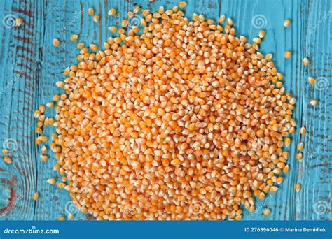 Corn Seeds Pile Of Raw Corn Grains Closeup On Blue Wood Rustic Table