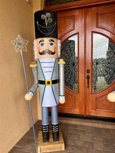 A Large Nutcracker Standing In Front Of A Door