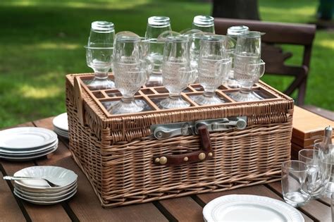 Premium Ai Image Doubledecker Picnic Basket With Glasses Plates And