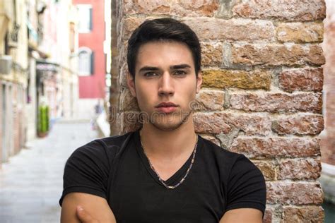 Attractive Young Man Standing Against Brick Wall Stock Photo Image Of