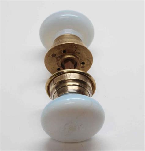 1930s Opalescent White Glass Fixed Door Knob Set With Brass Rosettes At 1stdibs