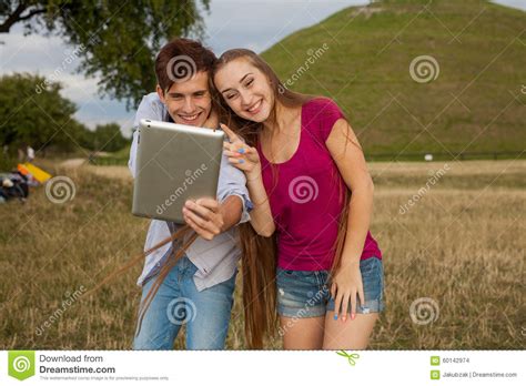 Two Friends With Mobile Phone Taking Selfies Summer Time Stock Photo