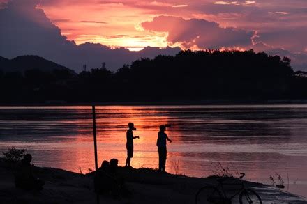 People Enjoying Sunset Over Brahmaputra River Editorial Stock Photo