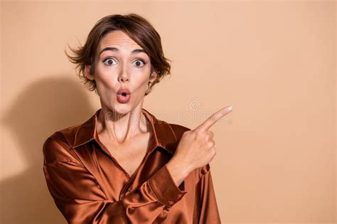 Photo Of Funky Impressed Woman Wear Silky Blouse Pointing Finger Empty