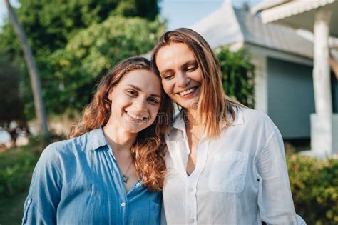 Portrait Of Happy Lesbian Couple Hugging Outdoors Stock Image Image