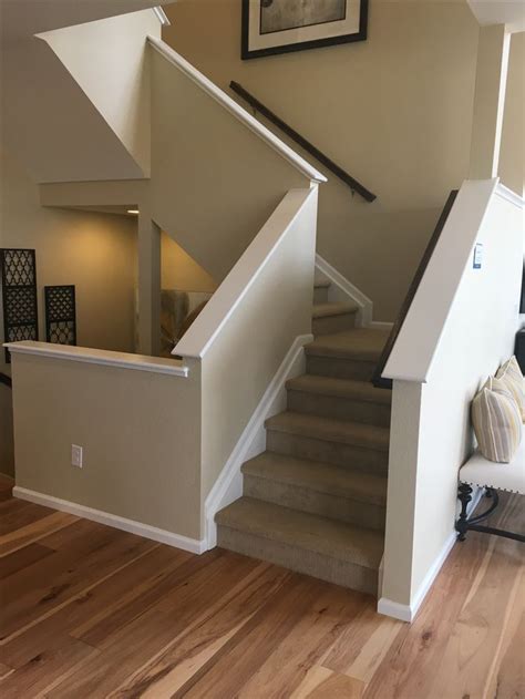 4 Easy Diy Ways To Finish Your Basement Stairs Banister Remodel Basement Design Stair Remodel