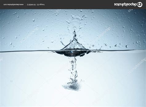 Ice Cube Splashing Water Drops Isolated White Stock Photo