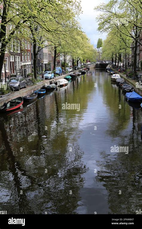 One of the characteristic canals of the city of Amsterdam Stock Photo ...