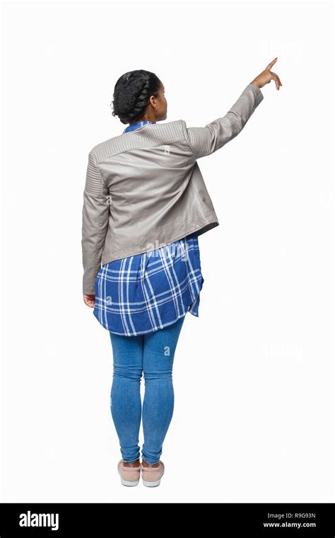 Back View Of A Black African American Woman In A Jacket Pointing Rear