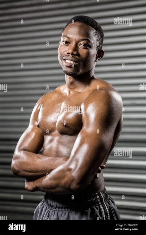 Shirtless Man Standing With Arms Crossed Stock Photo Alamy