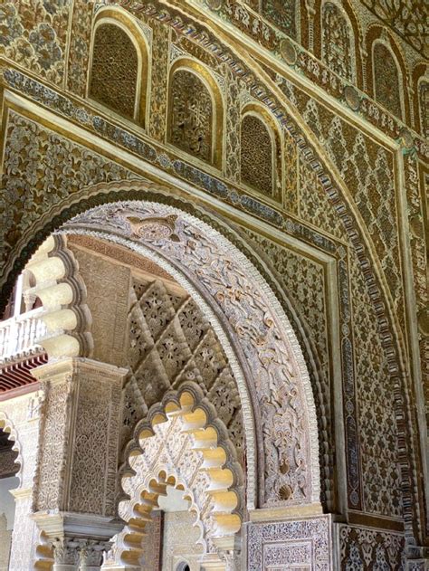 An Intricately Decorated Building With Arches And Pillars