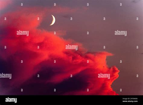 Crescent Moon And Red Clouds Stock Photo Alamy