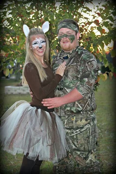 A Man And Woman Dressed Up As Deers For An Outdoor Halloween Costume