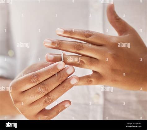 Close Up Of Woman Taking Off Wedding Ring Hands Removing Or Putting On