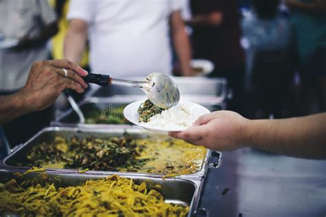 The Concept of Giving : Donating Food To the Homeless Stock Photo ...