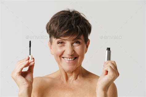 Mature Half Naked Woman Smiling While Showing Mascara Stock Photo By