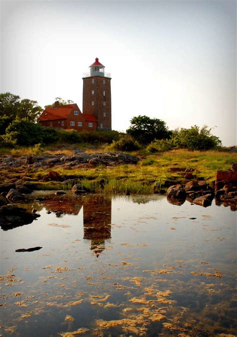 Svaneke Lighthouse Reflecting into the Sea | Stock image | Colourbox