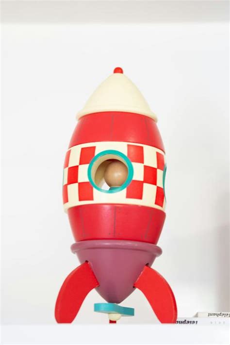 Wooden Toy Rocket on White Background · Free Stock Photo