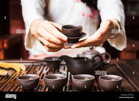 Woman Serving Chinese Tea In A Traditional Tea Ceremony Stock Photo Alamy