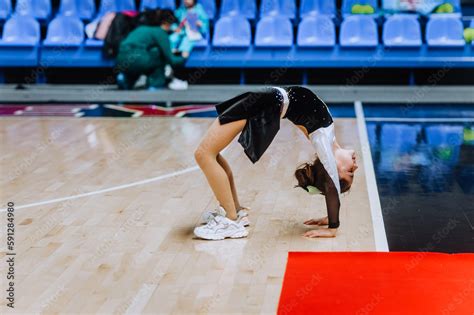 Beautiful girl, child, sportswoman cheerleader in uniform dancing ...