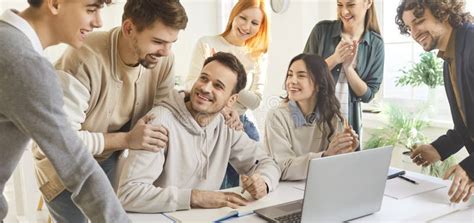 team happy college university students working successful digital