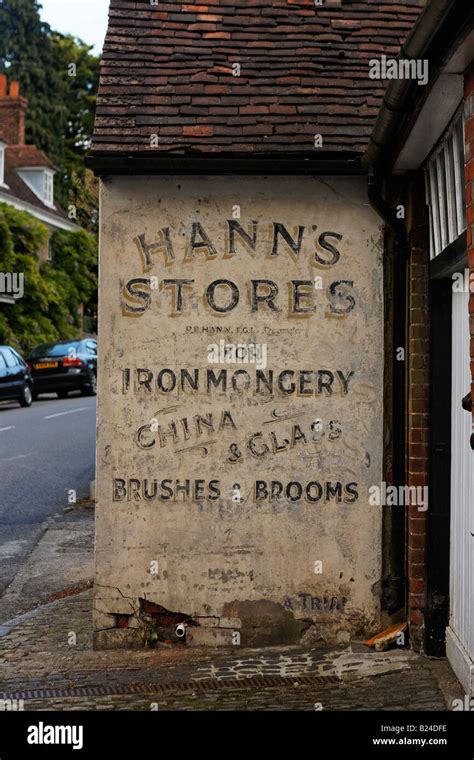 Old shop signage on the side of a store in Chevening, Nr. Sevenoaks, Kent Stock Photo - Alamy