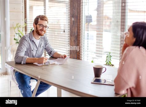 Man Woman Sitting Opposite Other Hi Res Stock Photography And Images