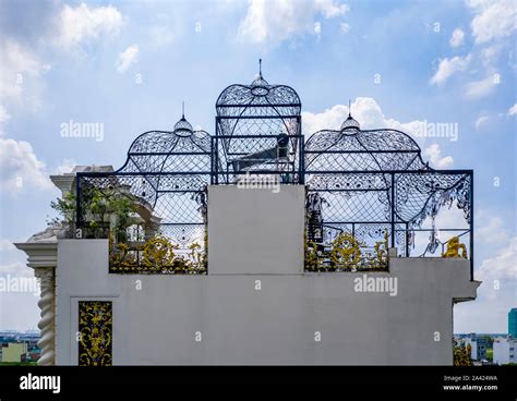 Ornate bird cage inspired roof design on grand mansion rooftop Stock Photo - Alamy