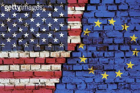 Flags Of Usa And European Union On The Brick Wall With Big Crack In The