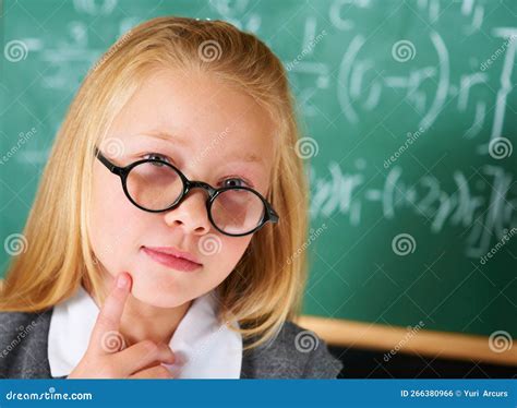 Searching For The Solution Portrait Of A Cute Blonde Girl Thinking In Class Stock Photo