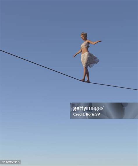 Young Woman Walking On Tightrope High Res Stock Photo Getty Images