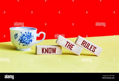 Know The Rules Word On Wooden Blocks Isolated On A Red And Yellow