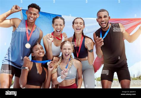 Happy And Proud French Olympic Athletes Celebrating Winning Medals For