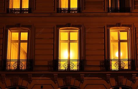 A Window Of An Apartment Building At Night Background Street Light