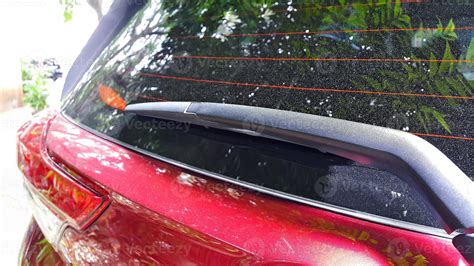 Close Up Of Rear Wiper In Red Car Car Rear Window With Anti Fog